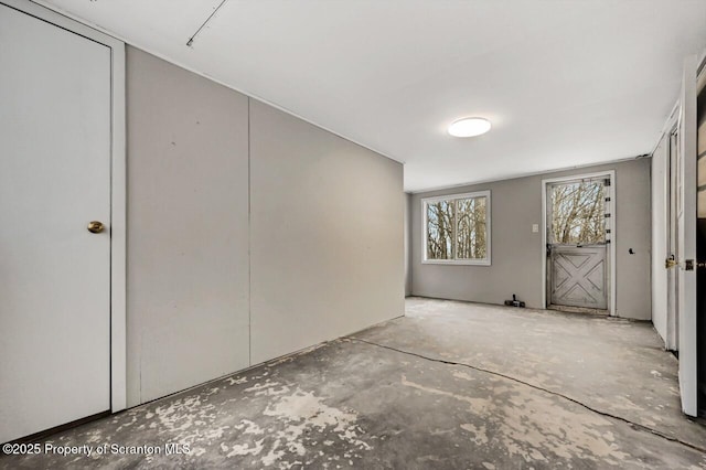 interior space featuring concrete flooring