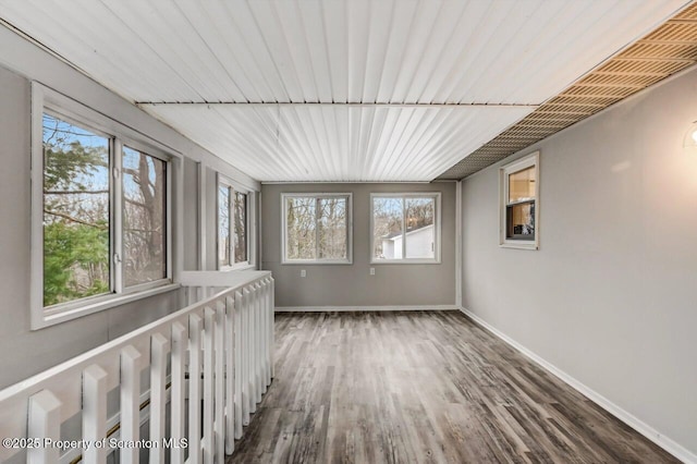 unfurnished sunroom featuring plenty of natural light