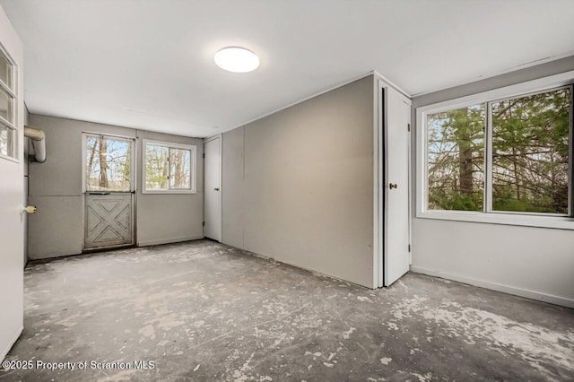 empty room with concrete flooring