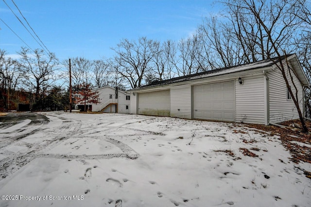 view of snow covered garage