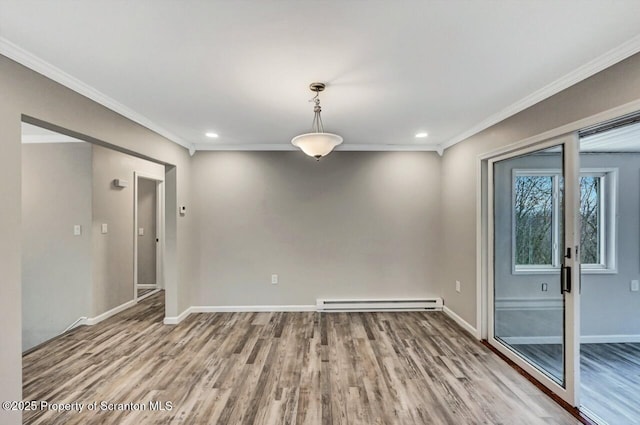 empty room featuring baseboard heating, light hardwood / wood-style floors, and ornamental molding