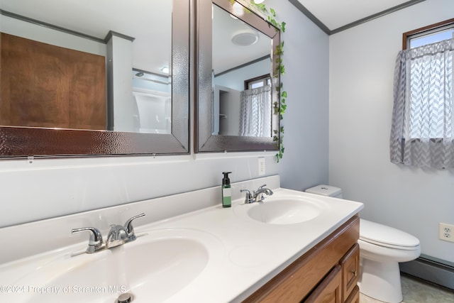 bathroom with crown molding, vanity, a baseboard radiator, and toilet