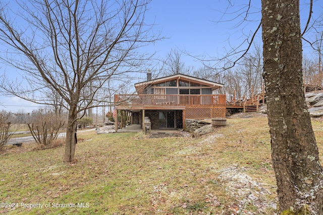 back of house with a patio area and a deck