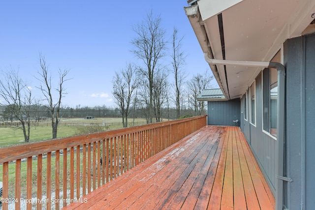 wooden deck featuring a rural view