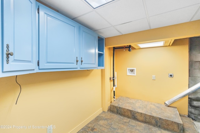 interior space with cabinets, hookup for a washing machine, and hookup for an electric dryer