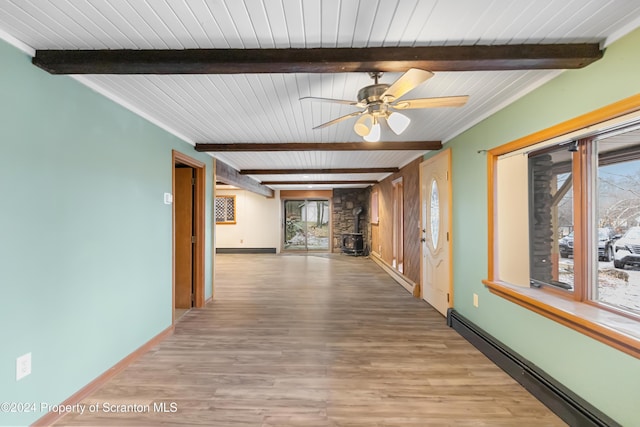 corridor featuring beam ceiling, light wood-type flooring, and a baseboard radiator