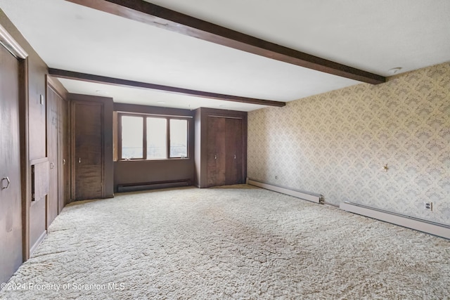 unfurnished bedroom with beam ceiling, baseboard heating, and light carpet