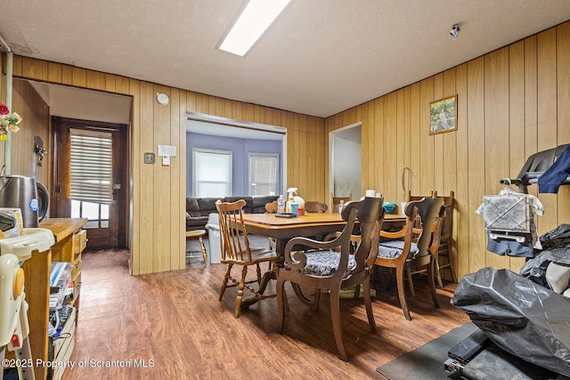 1004 Prospect Ave, Scranton, PA 18505 - dining area with wooden walls, wood finished floors, and plenty of natural light