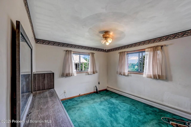 226 Linda Ln, Scranton, PA 18504 - unfurnished bedroom with a baseboard radiator, carpet floors, and ceiling fan