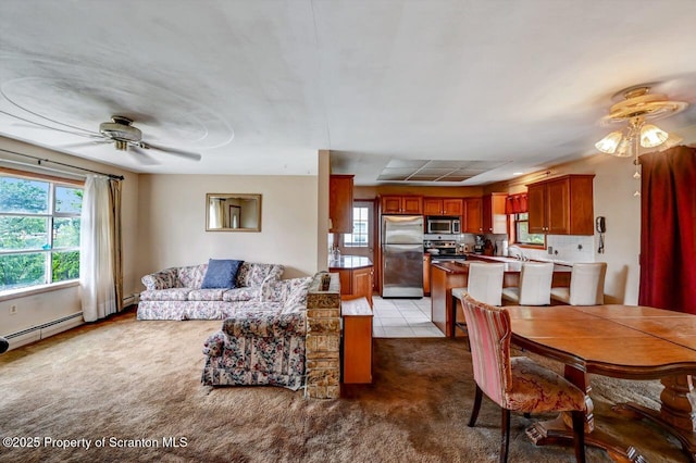 226 Linda Ln, Scranton, PA 18504 - carpeted living room featuring a ceiling fan and a baseboard heating unit