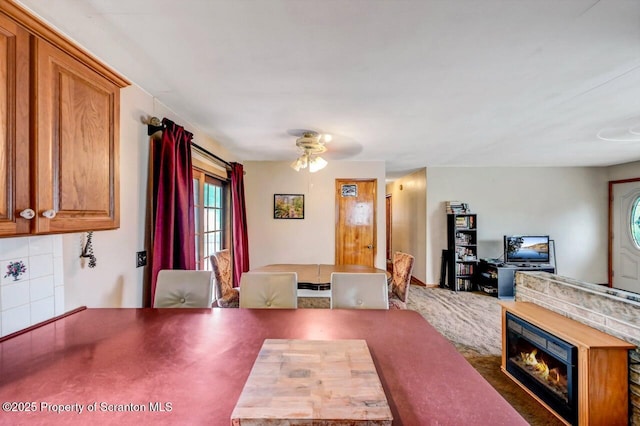 226 Linda Ln, Scranton, PA 18504 - dining space featuring a ceiling fan and a glass covered fireplace