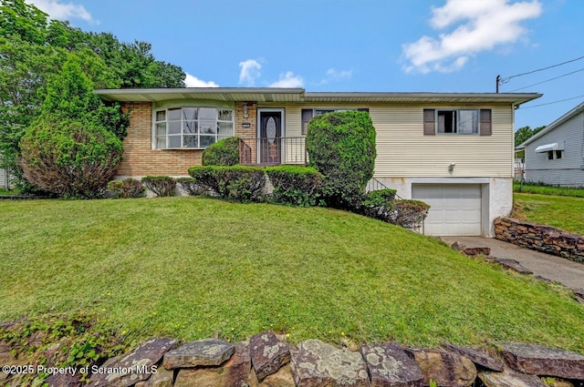 226 Linda Ln, Scranton, PA 18504 - single story home featuring an attached garage, concrete driveway, a front yard, and brick siding