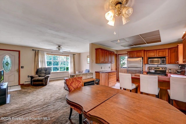226 Linda Ln, Scranton, PA 18504 - carpeted dining area with a ceiling fan, healthy amount of natural light, and a baseboard radiator