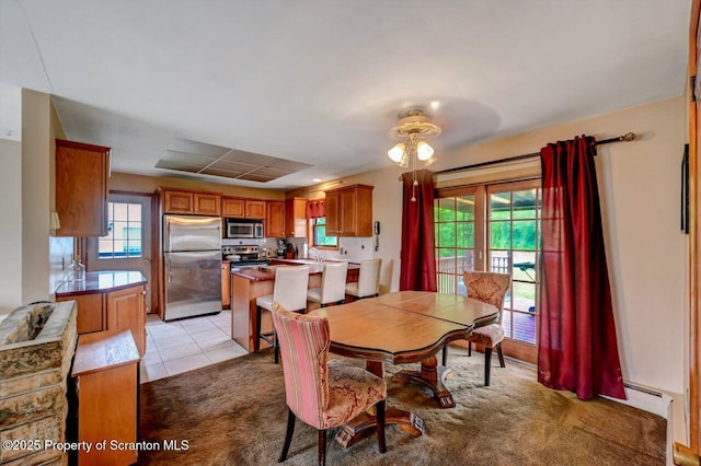 226 Linda Ln, Scranton, PA 18504 - dining area with light carpet and light tile patterned floors
