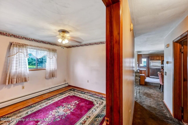 226 Linda Ln, Scranton, PA 18504 - unfurnished room with a baseboard heating unit and ceiling fan