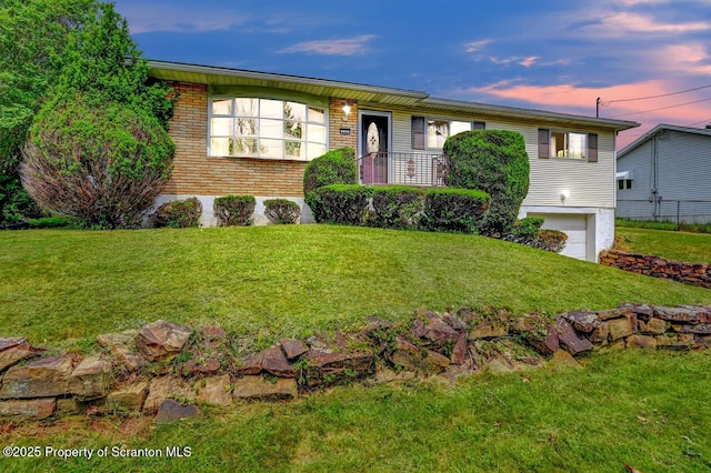 226 Linda Ln, Scranton, PA 18504 - ranch-style home featuring brick siding, a front lawn, and a garage