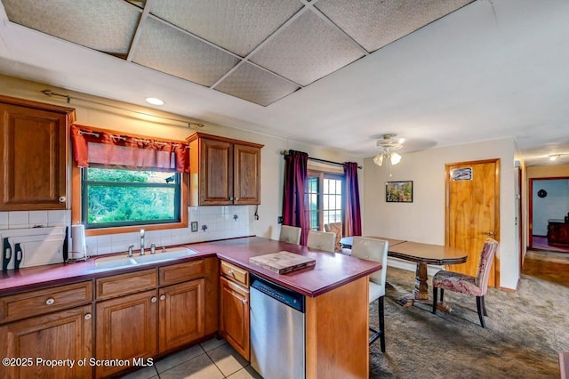 226 Linda Ln, Scranton, PA 18504 - kitchen with dishwasher, a peninsula, and brown cabinetry