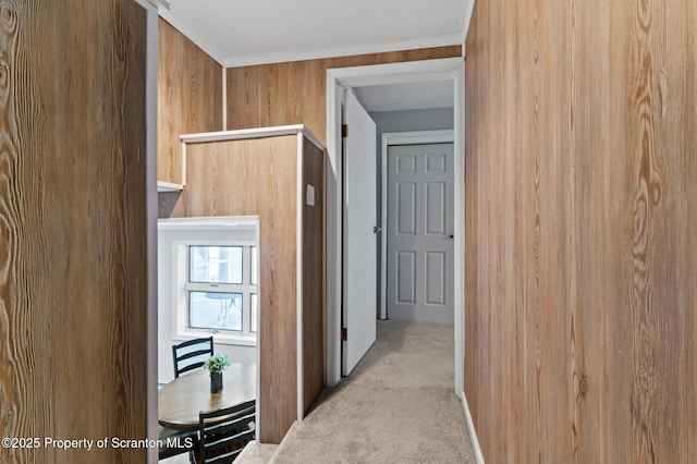 hall featuring light colored carpet