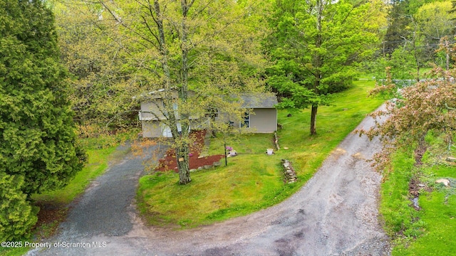 drone / aerial view featuring a forest view