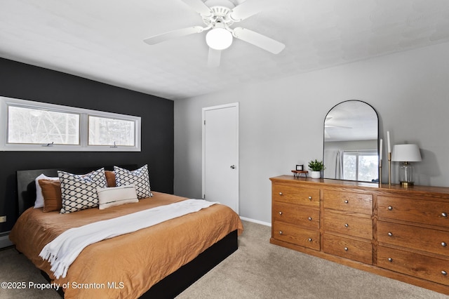 bedroom with light colored carpet and ceiling fan