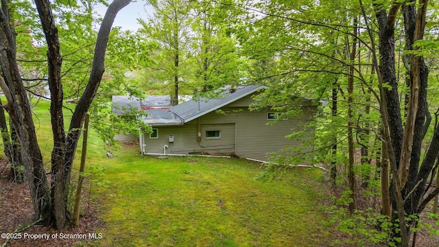 back of house featuring a yard