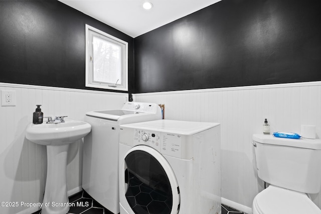 laundry area featuring sink, tile patterned flooring, and washer and dryer