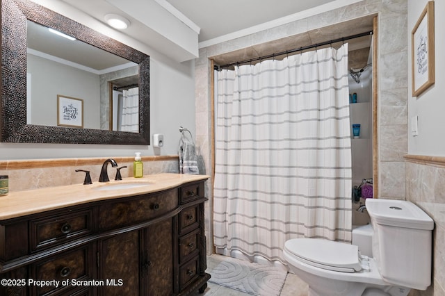 full bathroom featuring shower / bathtub combination with curtain, tile walls, vanity, ornamental molding, and toilet