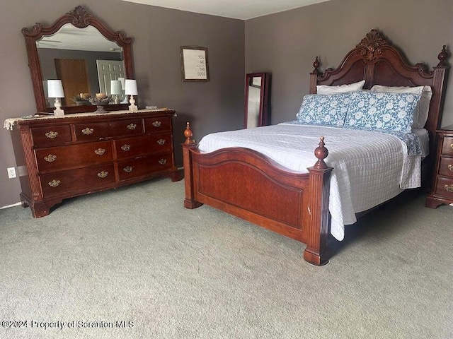 bedroom with light colored carpet