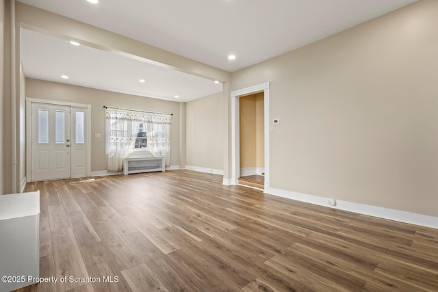 1324 Dartmouth St, Scranton, PA 18504 - unfurnished living room with wood finished floors and recessed lighting