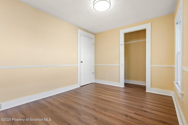 1324 Dartmouth St, Scranton, PA 18504 - unfurnished bedroom with wood finished floors and a closet