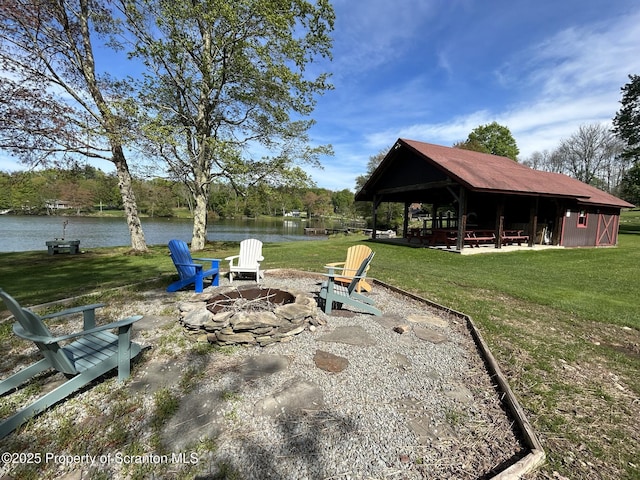 273 State Route 2067, Clifford Twp, PA 18470 - view of green lawn with a fire pit and a water view