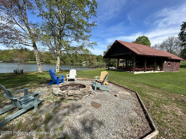 273 State Route 2067, Clifford Twp, PA 18470 - view of green lawn with a fire pit and a water view