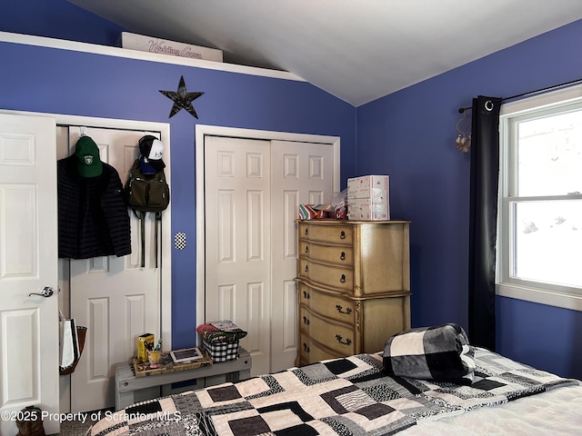 bedroom with lofted ceiling