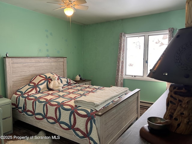 bedroom featuring a baseboard radiator and ceiling fan