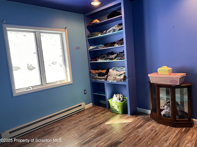 closet featuring baseboard heating