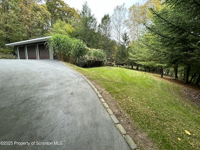 view of yard with a garage