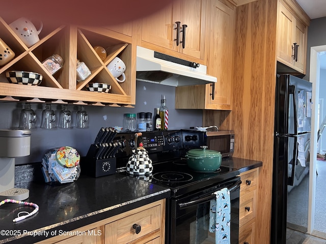 kitchen with light brown cabinetry and black appliances