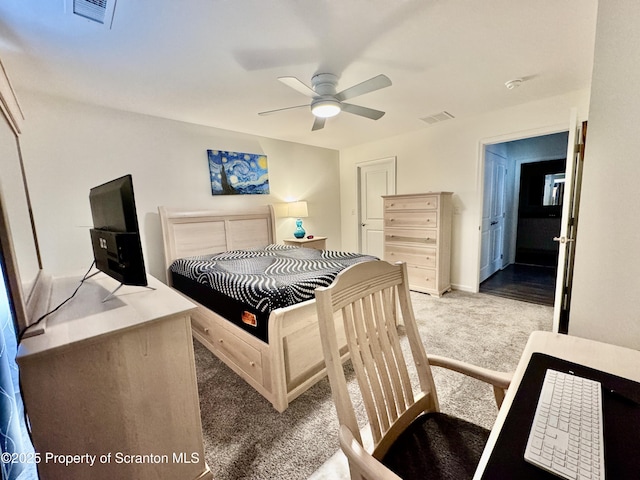 bedroom featuring light colored carpet and ceiling fan