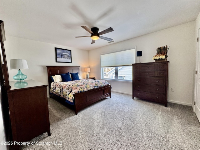 bedroom with light carpet and ceiling fan