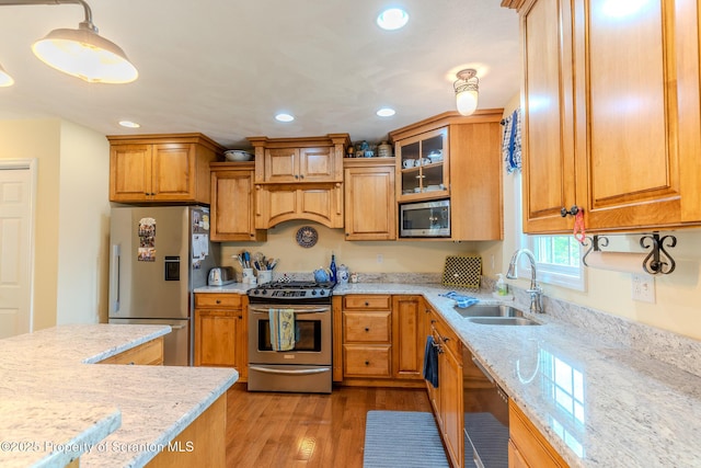 99 Elizabeth Ave, Hallstead, PA 18822 - kitchen with appliances with stainless steel finishes, a sink, light stone counters, recessed lighting, and light wood finished floors
