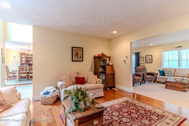 99 Elizabeth Ave, Hallstead, PA 18822 - living room with wood finished floors, a chandelier, recessed lighting, and baseboards