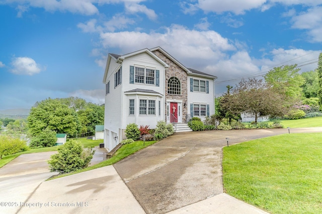 99 Elizabeth Ave, Hallstead, PA 18822 - view of front of property featuring concrete driveway, a front lawn, and stone siding