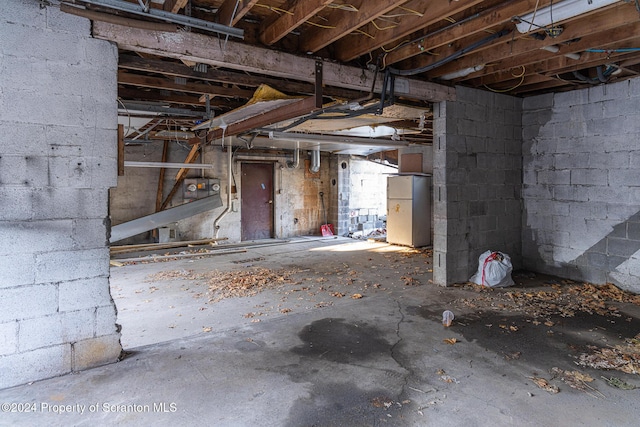 basement with white fridge