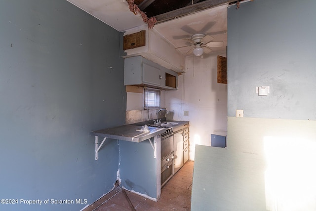 kitchen with ceiling fan and sink