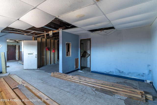 basement featuring a drop ceiling