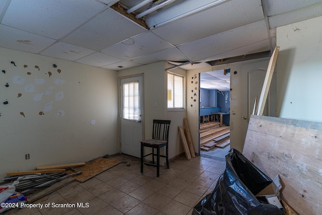 interior space featuring a drop ceiling