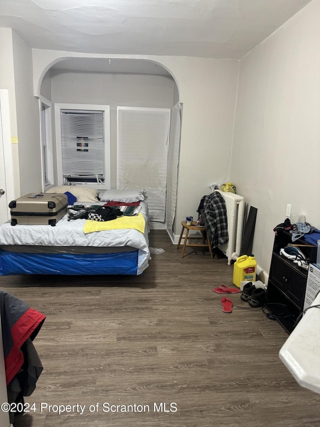 bedroom with wood-type flooring