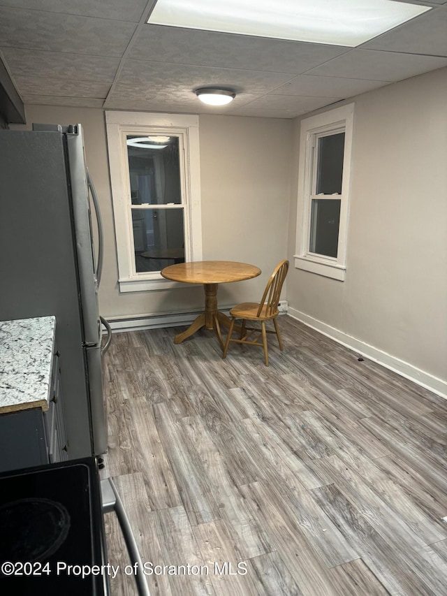 dining room with wood-type flooring