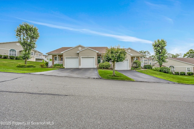 8 Parkland Dr Bldg 9, South Abington Twp, PA 18411 - ranch-style house with asphalt driveway, a garage, a front yard, and a residential view