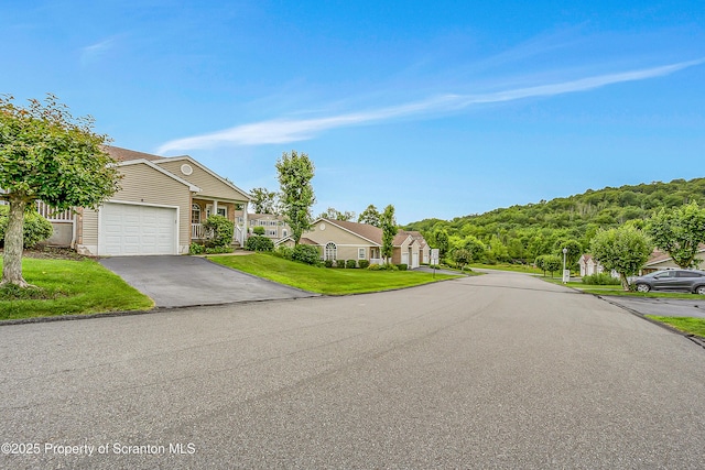 8 Parkland Dr Bldg 9, South Abington Twp, PA 18411 - view of front of house featuring an attached garage, a front lawn, and driveway